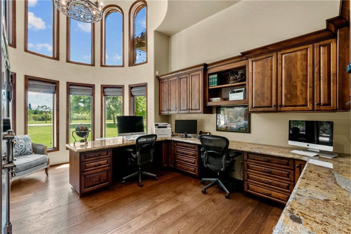 Home office with glass windows and a custom cabinetry,