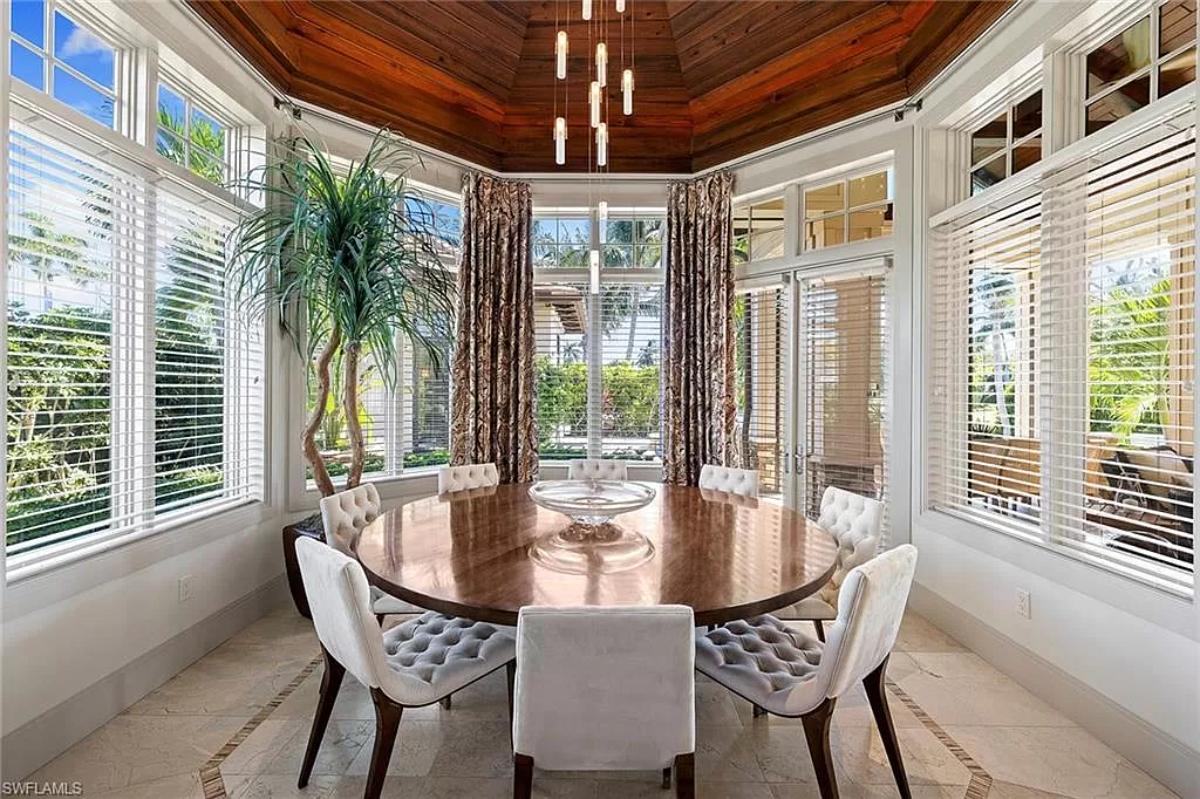 Dining room with a round wood table.