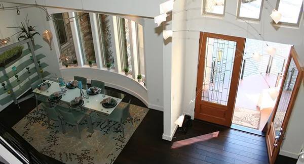 Foyer and dining room with a French door and a bow window.