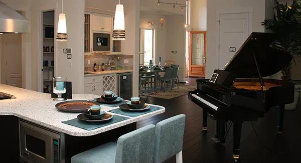 An open layout view of the kitchen, living room, and dining area.