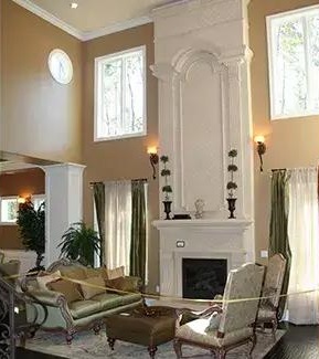 Great room with traditional seats and a fireplace.