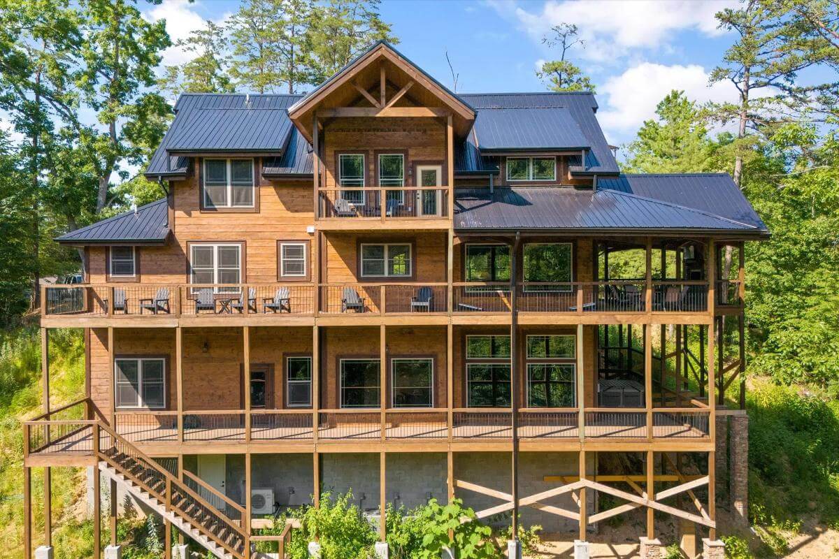 Rear view with stacked porches and a multitude of windows.