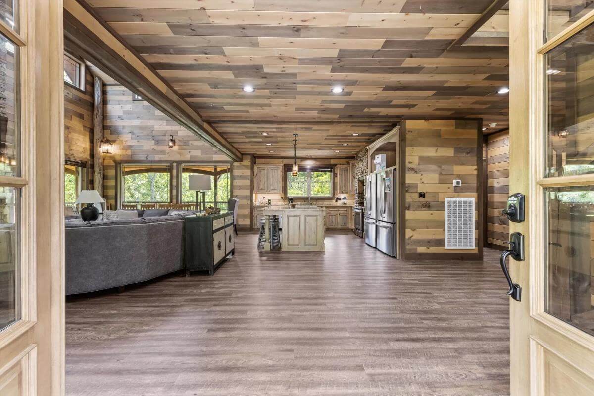 Foyer with hardwood flooring and a view of the open living space.