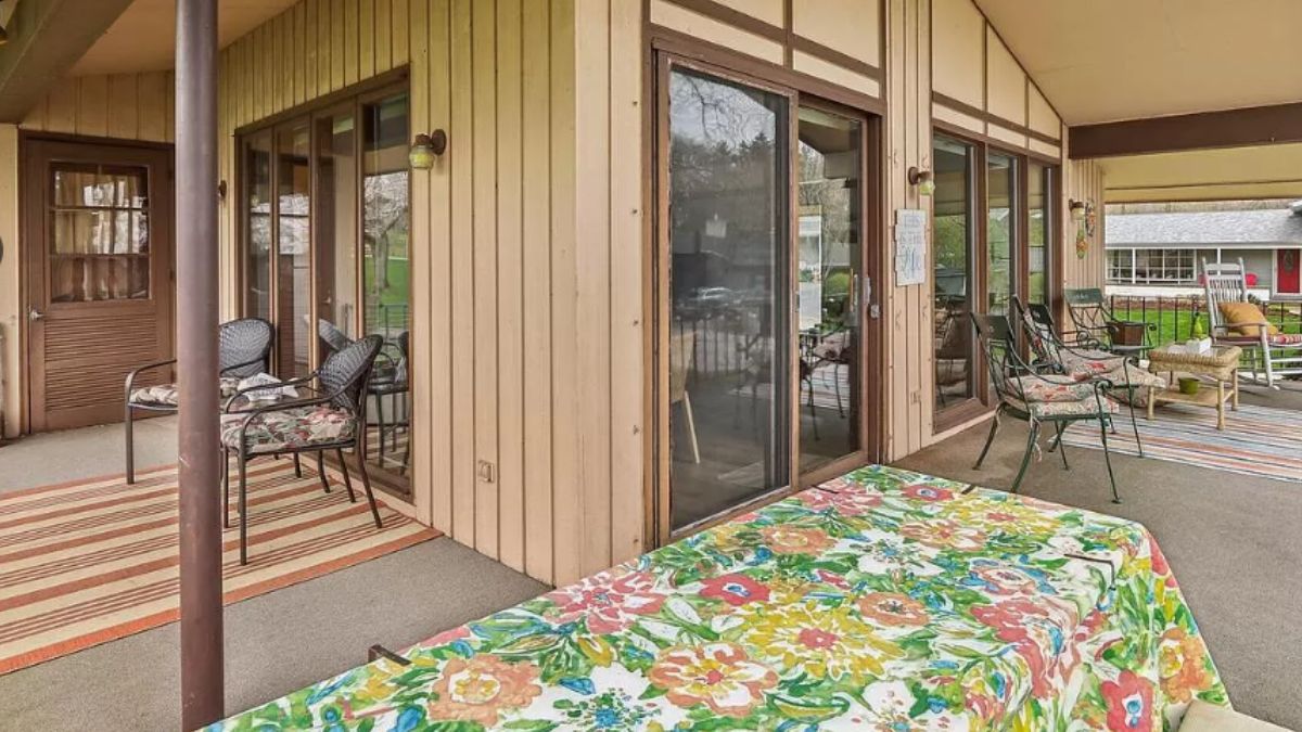 A terrace with a table, chairs, and a coffee table.