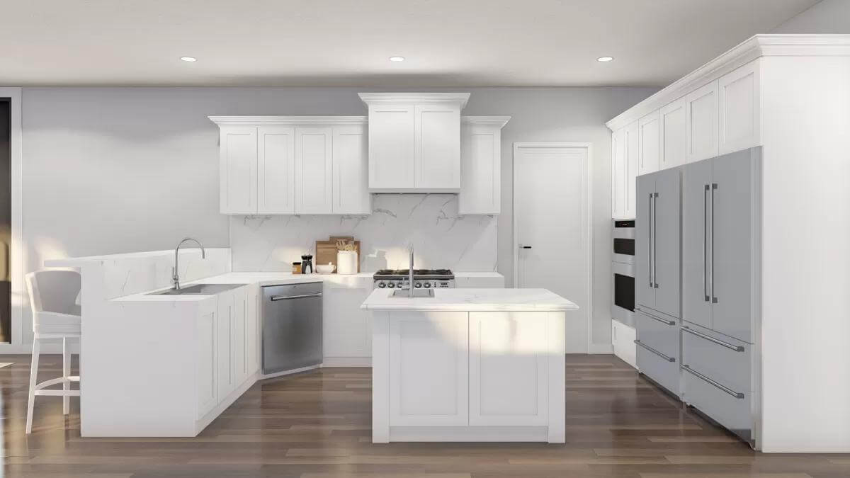 Kitchen with white cabinetry, a center island, and a peninsula with a raised eating bar.