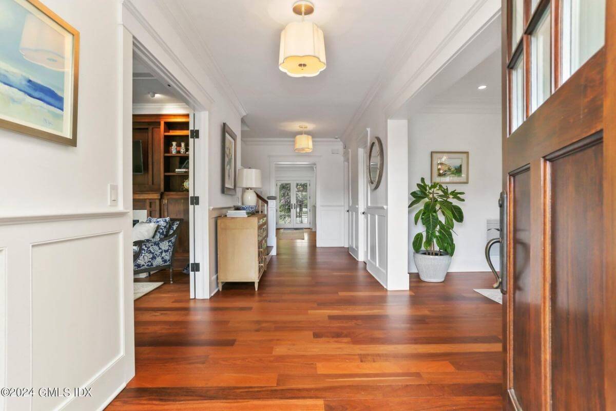 Foyer with a hardwood floor and a console table.