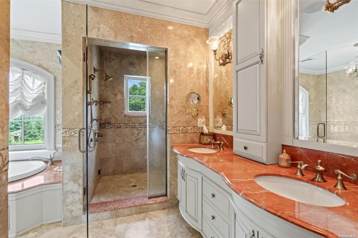 Bathroom with a sink, soaking tub and a walk-in shower.