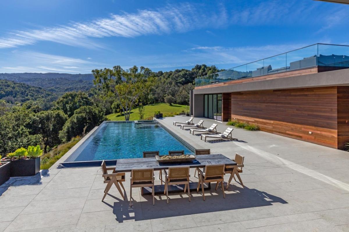 Pool with a dining area.