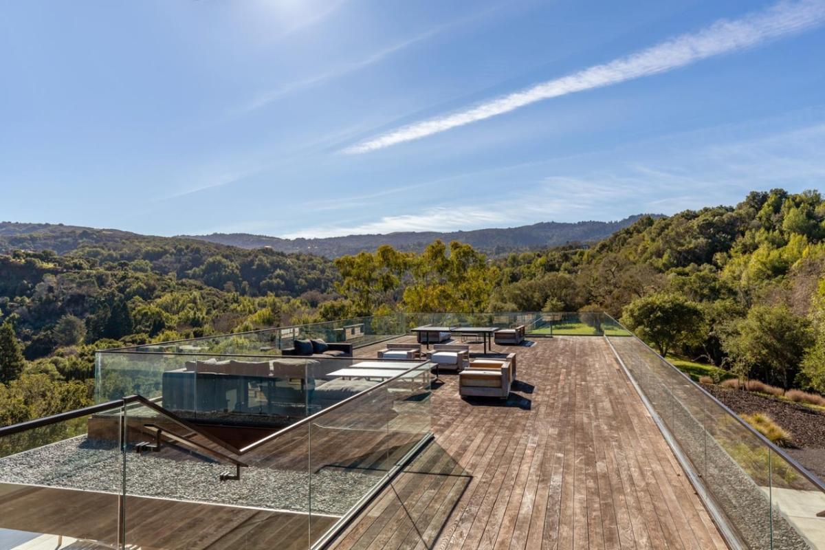 Rooftop deck with a living space and a table tennis.