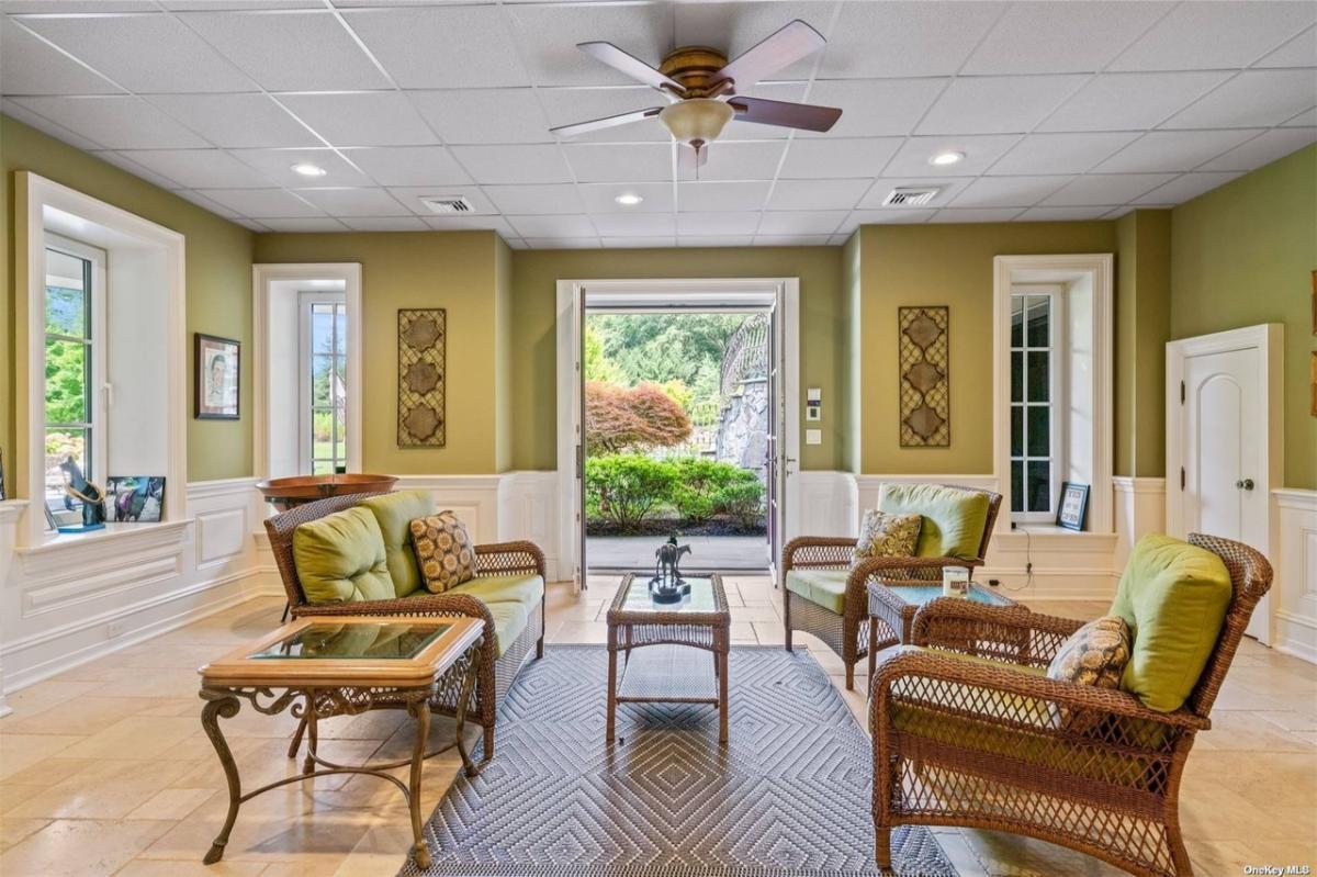 Living room with tables and chairs.