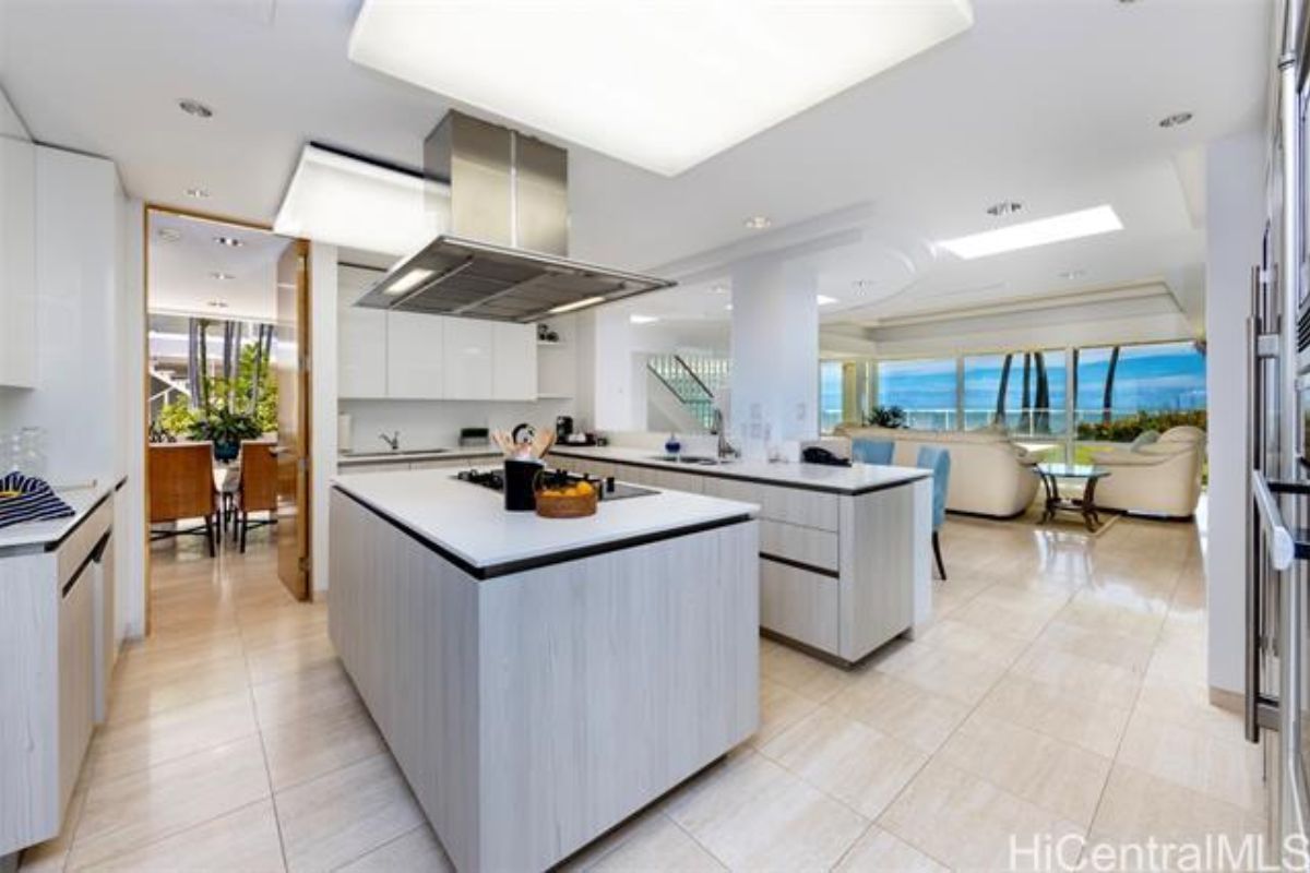 A great room with a kitchen, dining area, and living space.