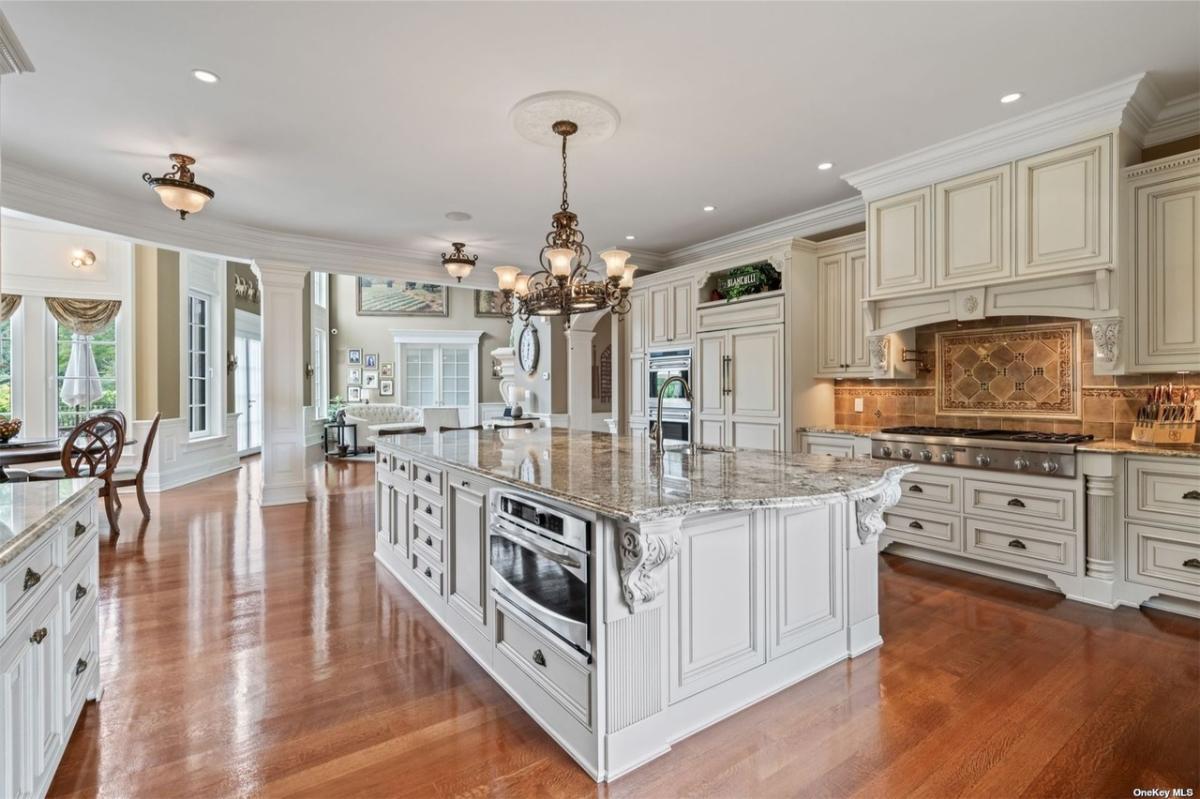 Kitchen with custom cabinetry and a counter breakfast bar.