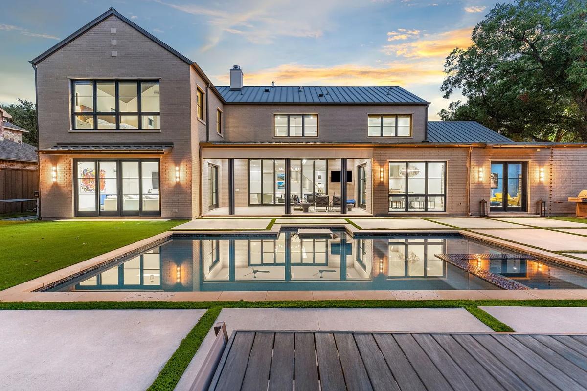 Rear view of the mansion with a pool.