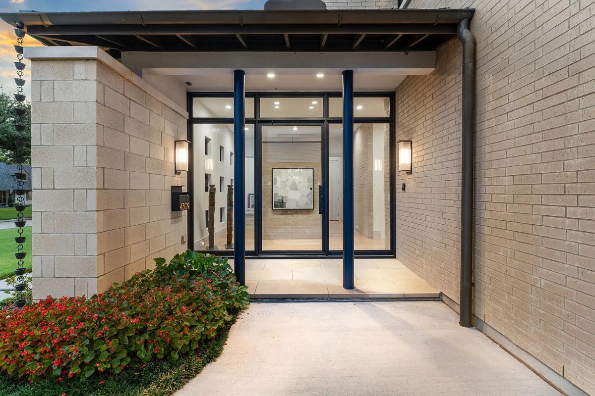 Front entry of the mansion with a glass door.