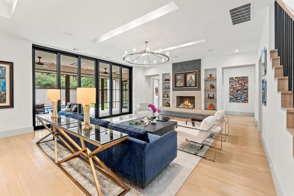 Living room with couches and a fireplace.