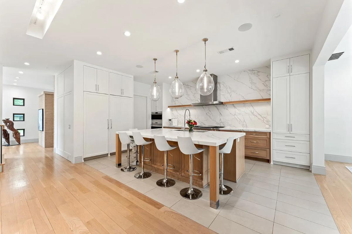 Kitchen with custom cabinetry and a counter breakfast bar.