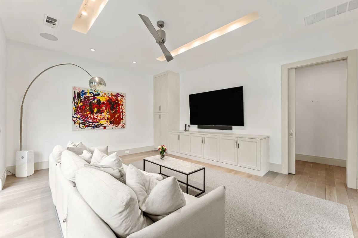 Family room with couches and a TV.