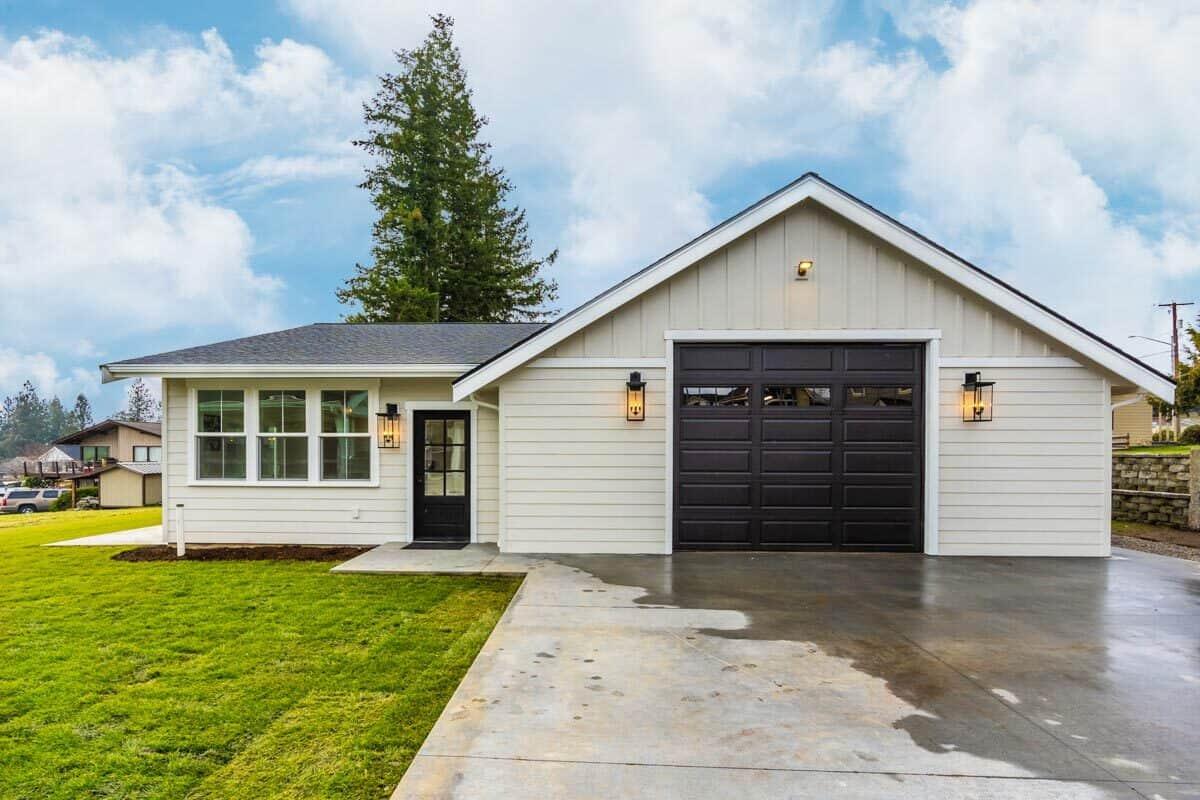 Check Out the Sleek Black Garage Door on This Modern Ranch-Style Home