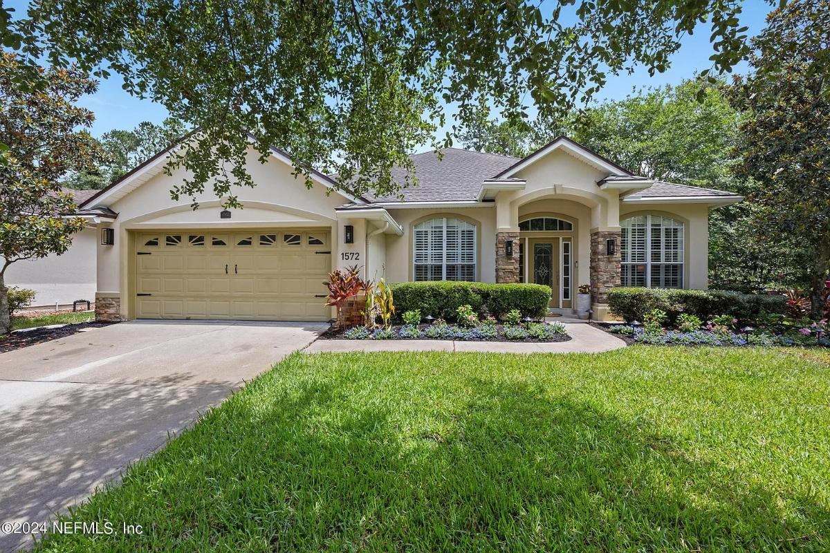 Charming Suburban Home with Stone Accent Columns