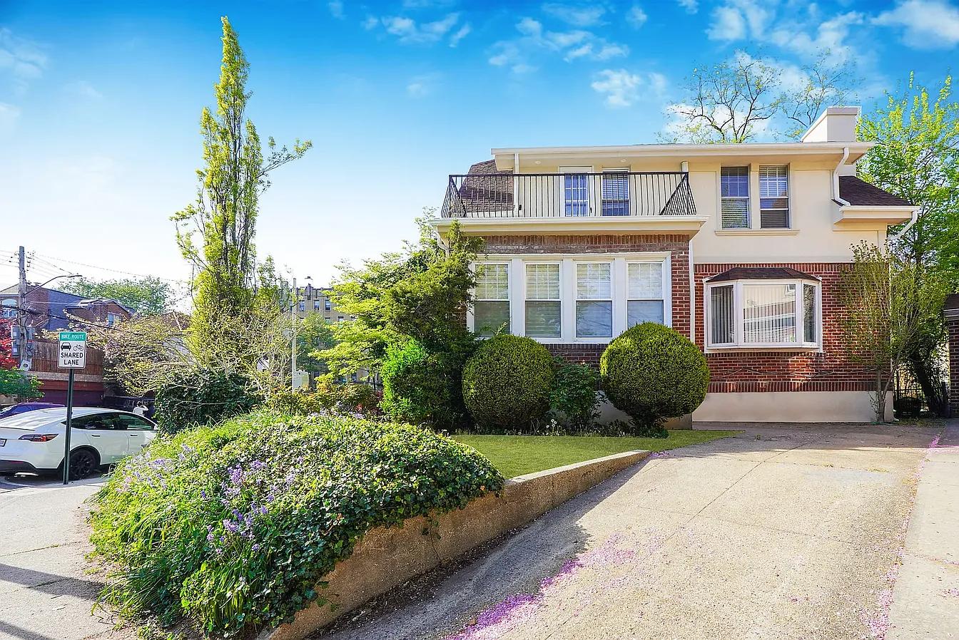 Classic Brick Home with Charming Upper Balcony