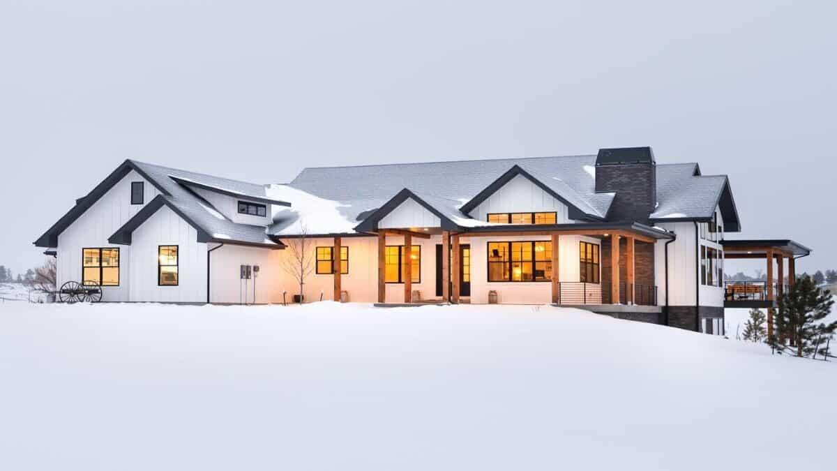 Modern Farmhouse Elegance with Striking Rooflines