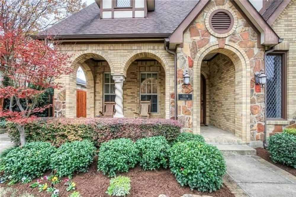 Charming Facade with Intricate Stonework and Arched Entrances