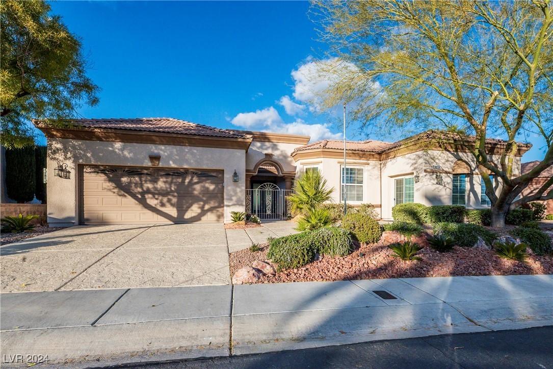 Desert Oasis with Stucco Exterior and Arched Entryway