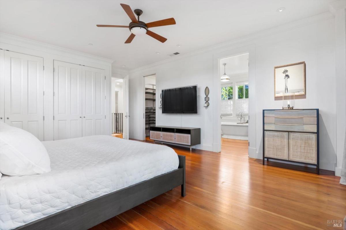 A bedroom leading to an en-suite bathroom and a walk-in closet.