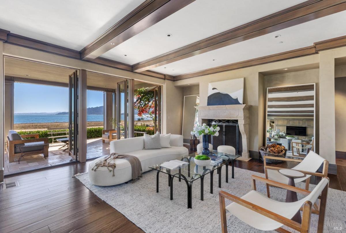 Living room with a large sectional sofa, coffee table, and two chairs.