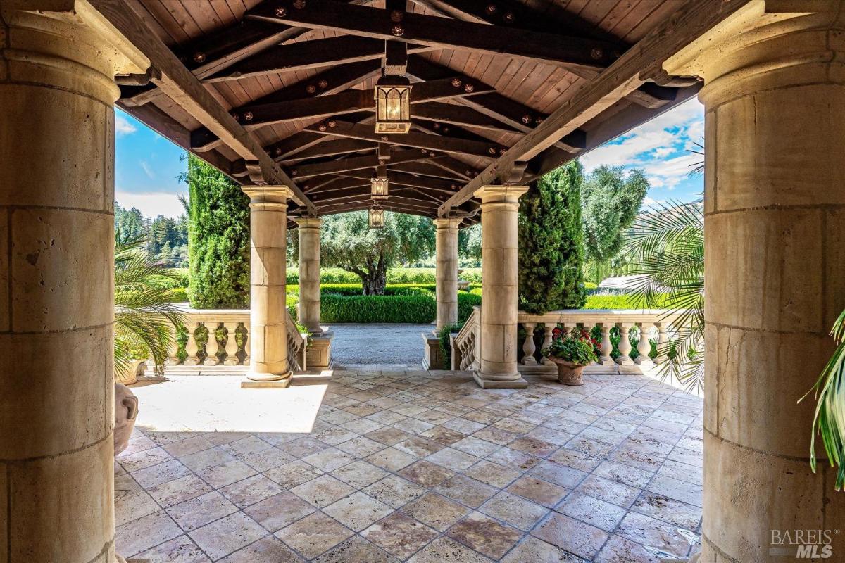 A pergola with limestone flooring.