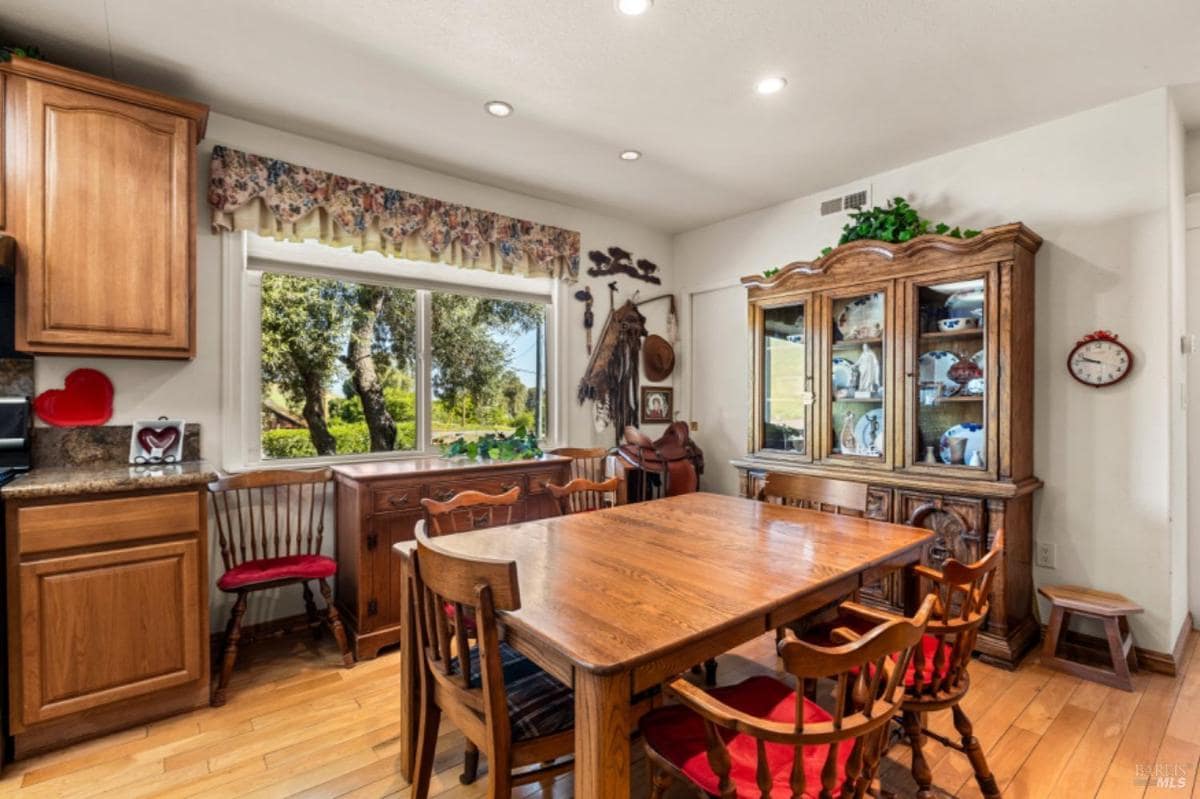 Dining room with wooden furniture and a china cabinet.