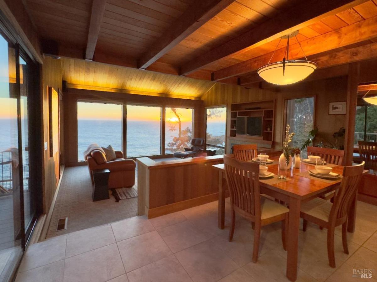 Dining area with ocean-facing windows.