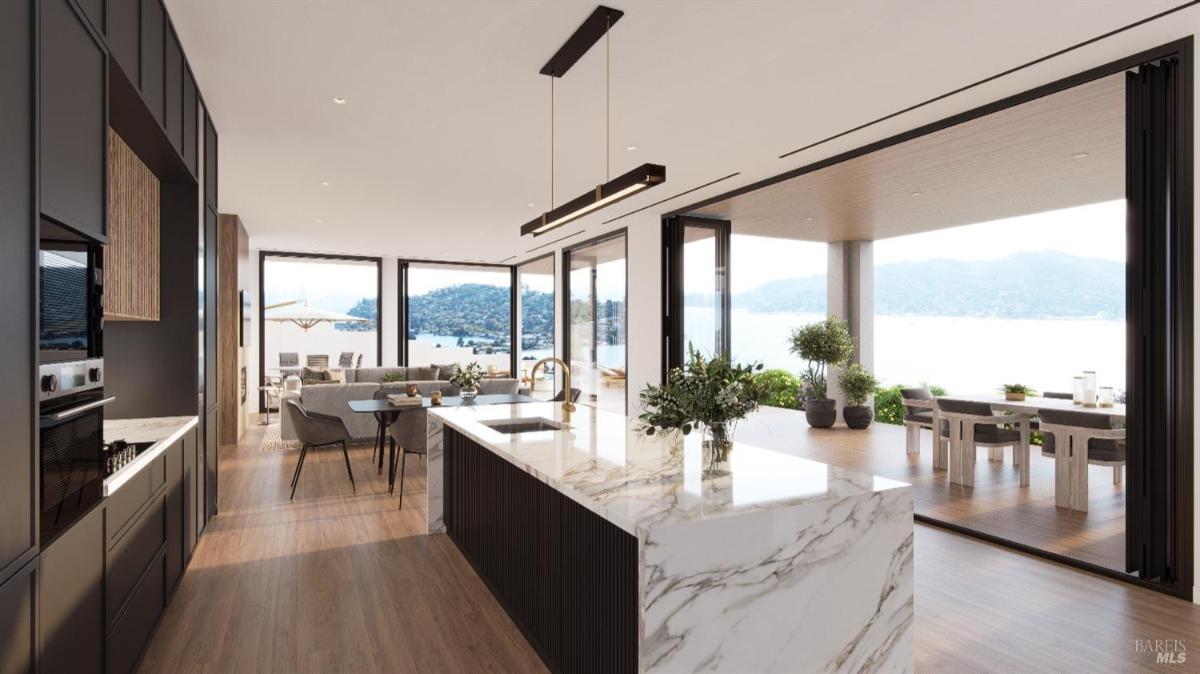 Kitchen featuring a marble island and modern appliances. 