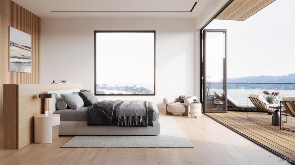 Contemporary bedroom with a large window showcasing a scenic view. 