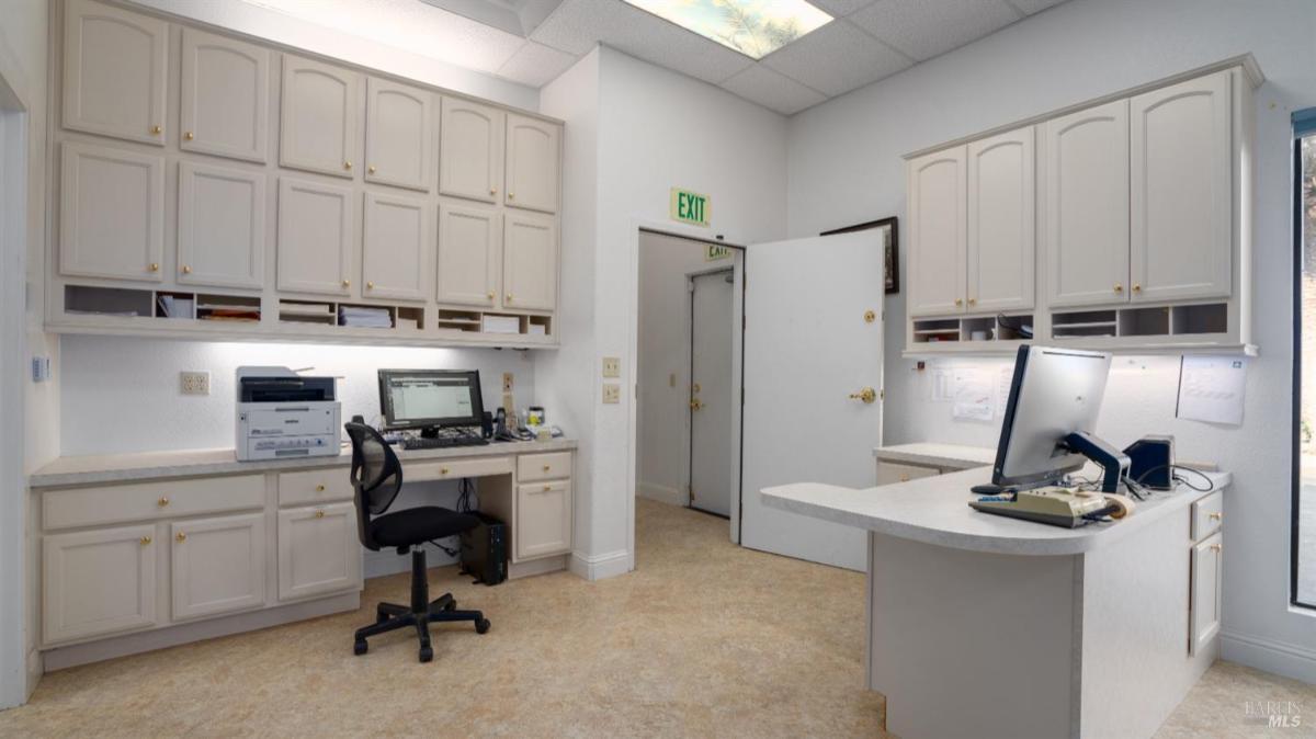 Office space with built-in cabinets and workstations.