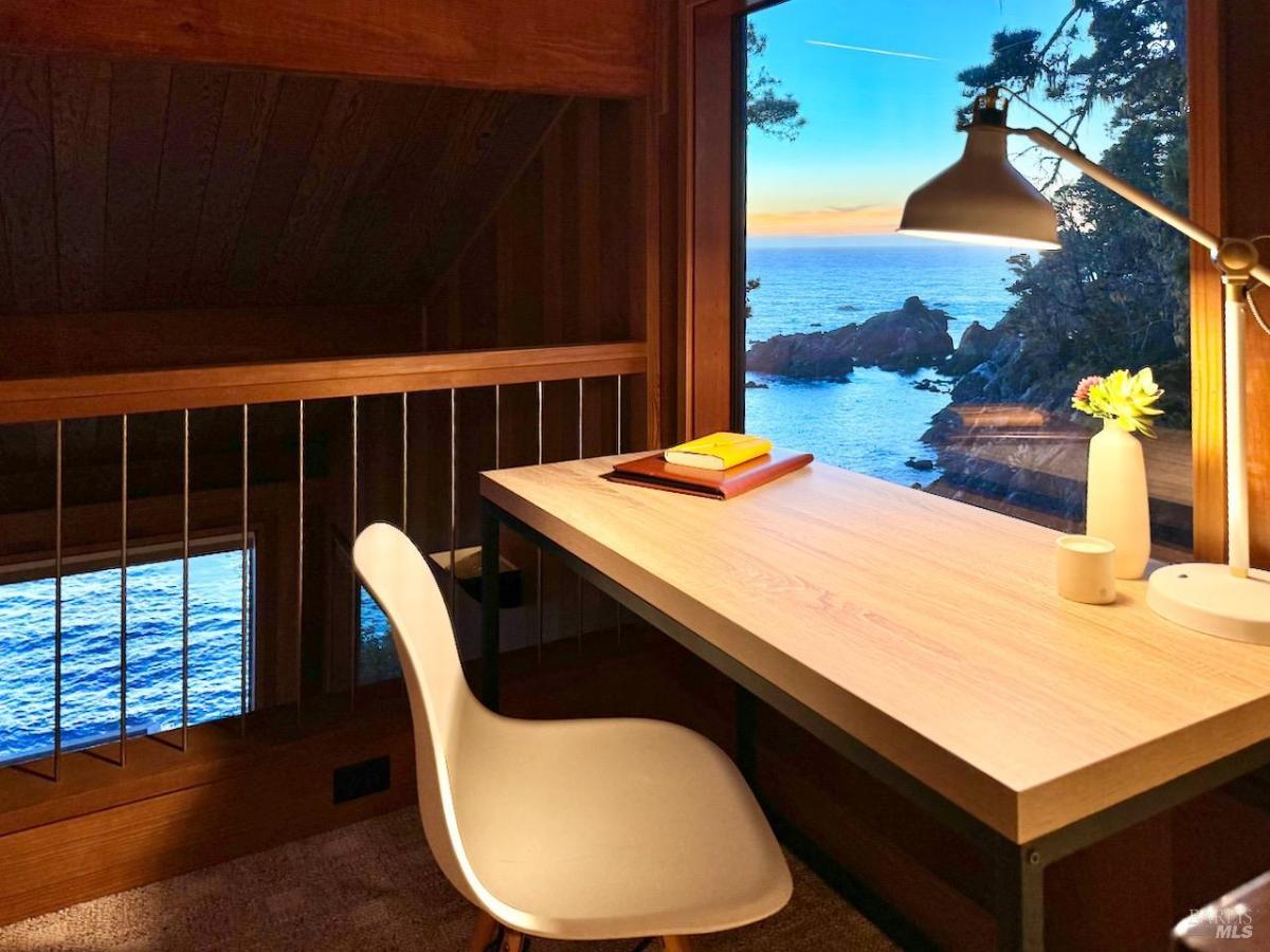 Desk with ocean view from a loft area.