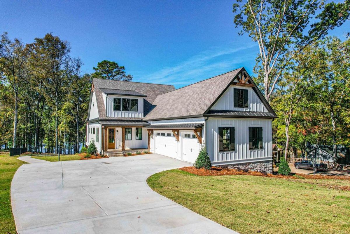 Farmhouse design combines crisp white siding.