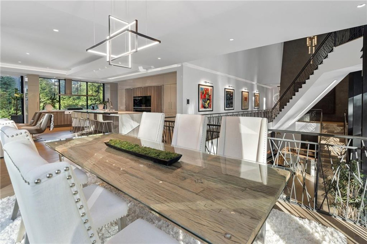 Open-concept space seamlessly connects a stylish dining area.