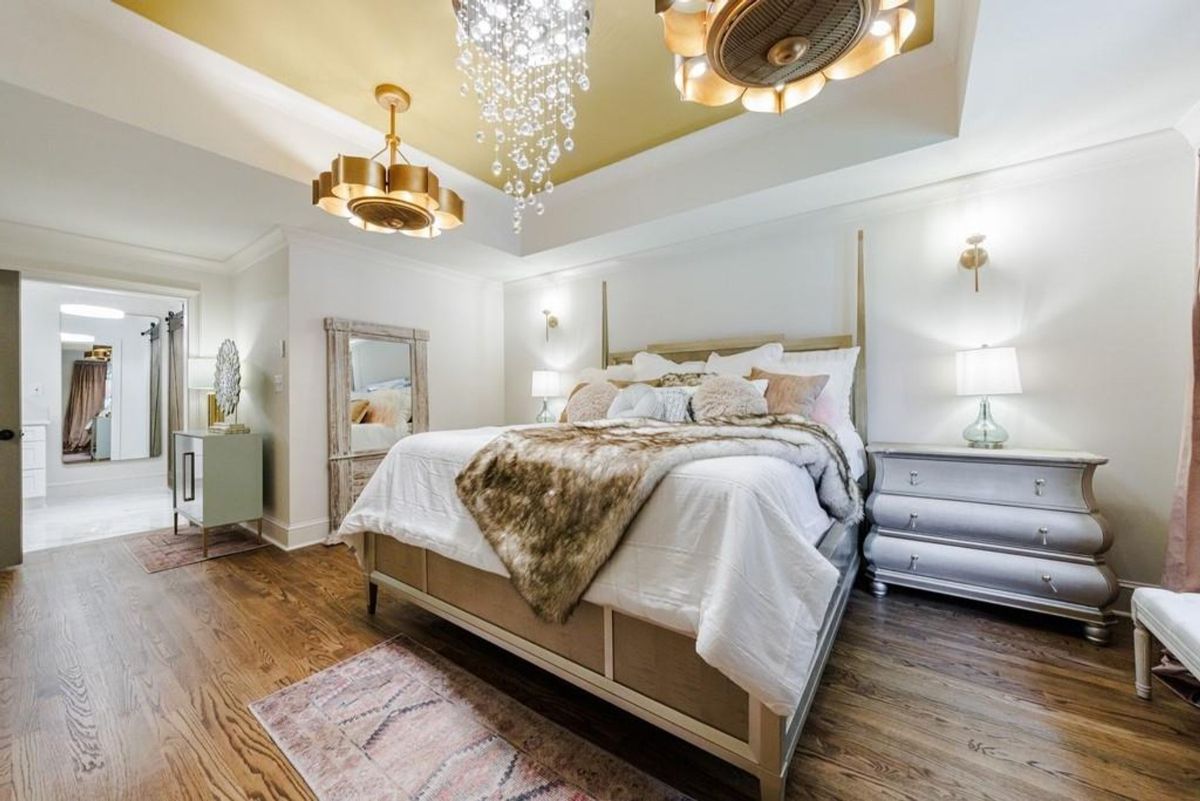 Luxurious master suite boasts a king-size bed