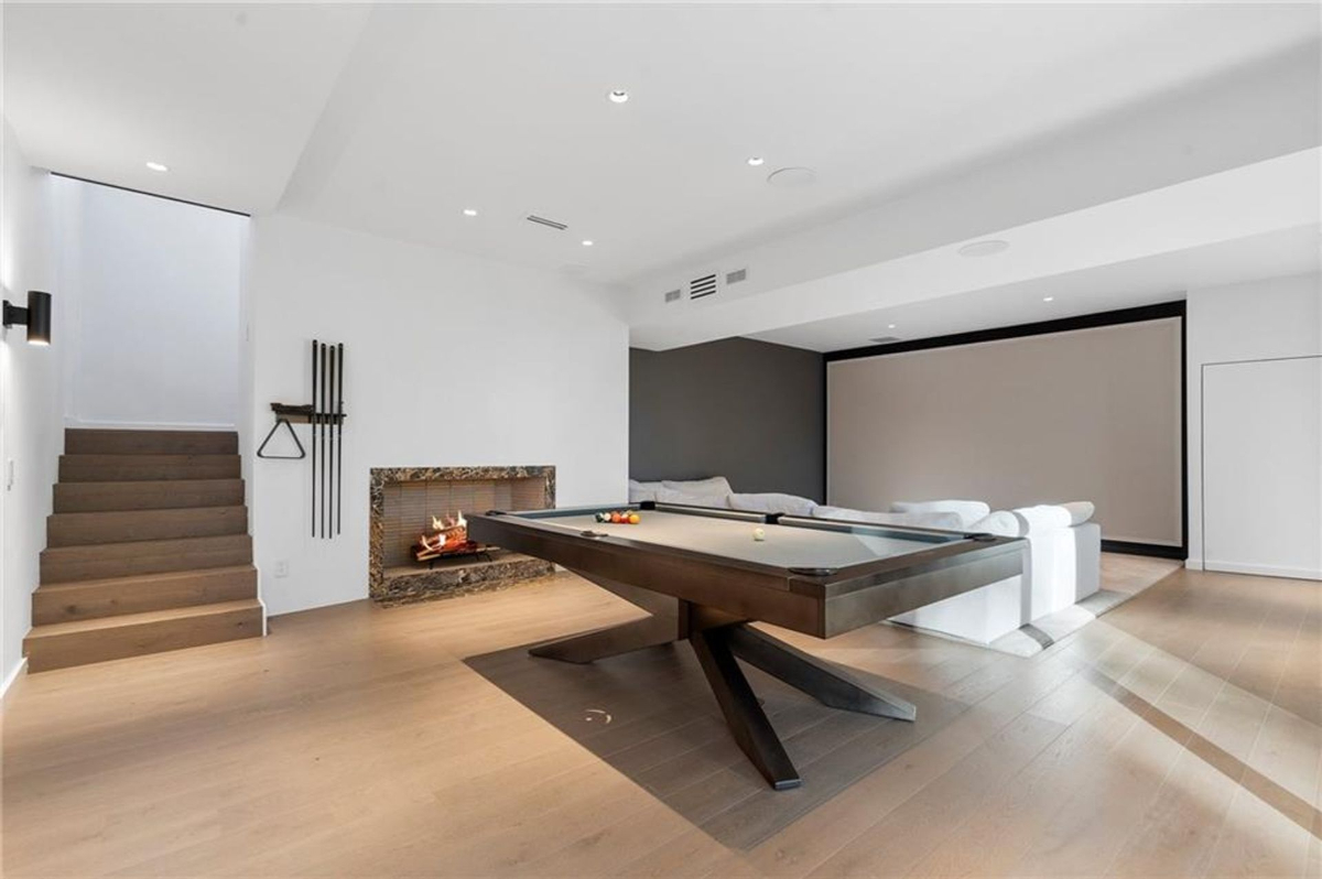 Game room offers a billiards table.