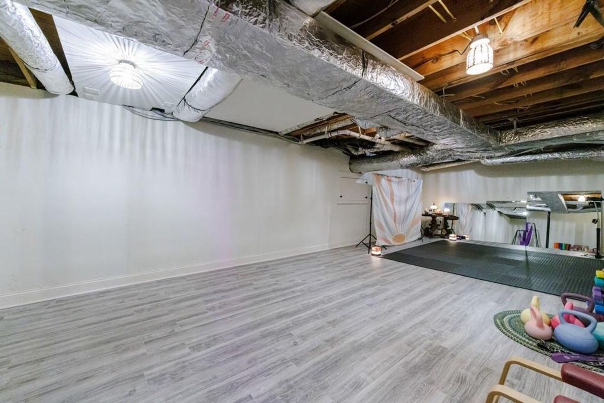 Large basement area features a spacious open floor plan with light gray flooring.