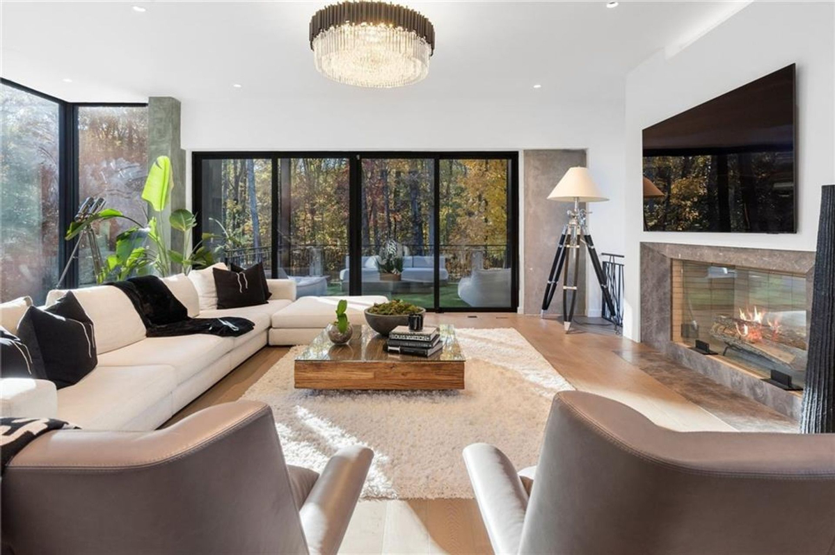 A chic living room designed with modern elegance, featuring a plush sectional sofa.