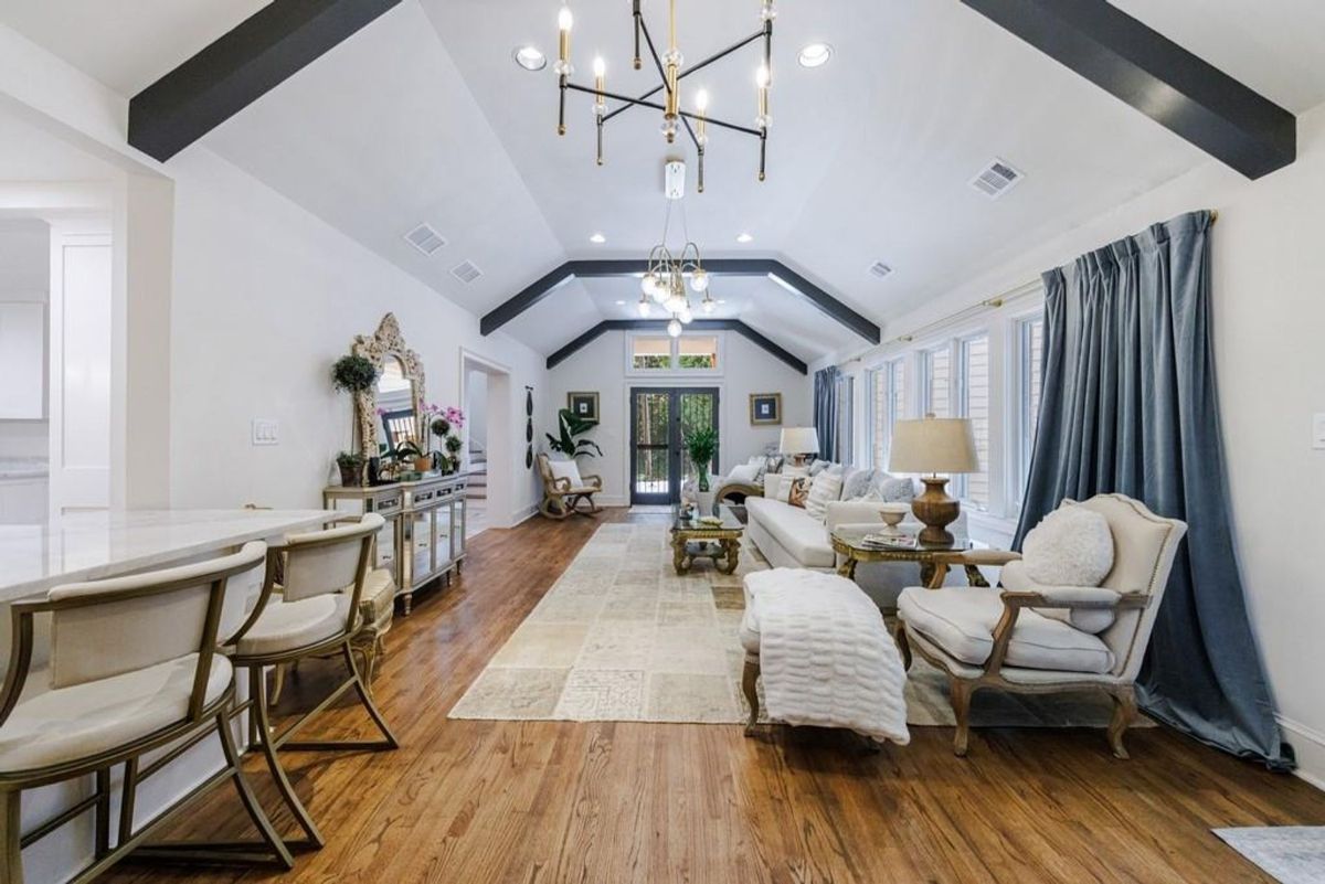 Vaulted living room showcases exposed beams