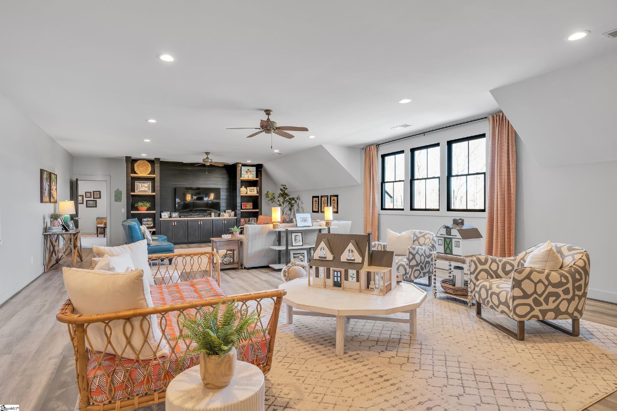 Spacious family room blending comfort and style with cozy seating, custom built-ins, and ample natural light.