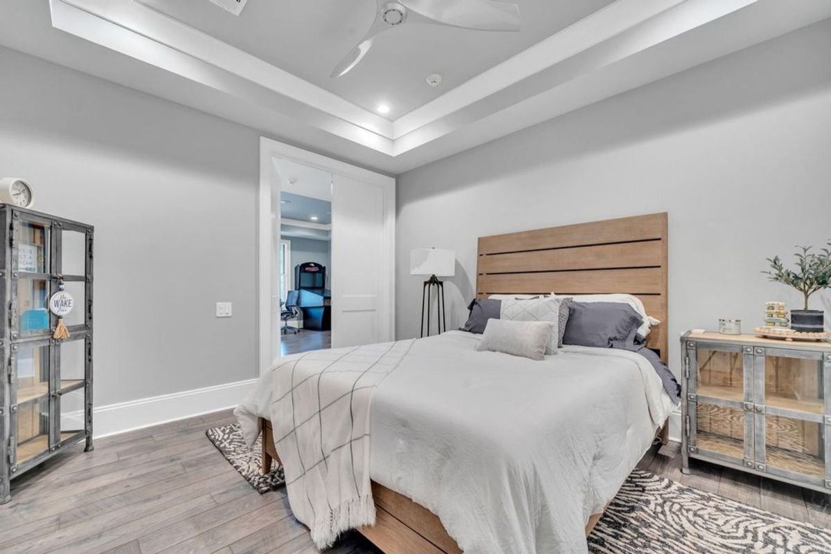 The modern farmhouse style combines comfort and functionality in this charming bedroom.