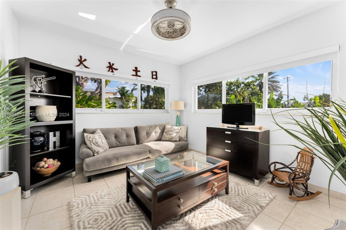 Sunlit seating area with garden views and modern decor.