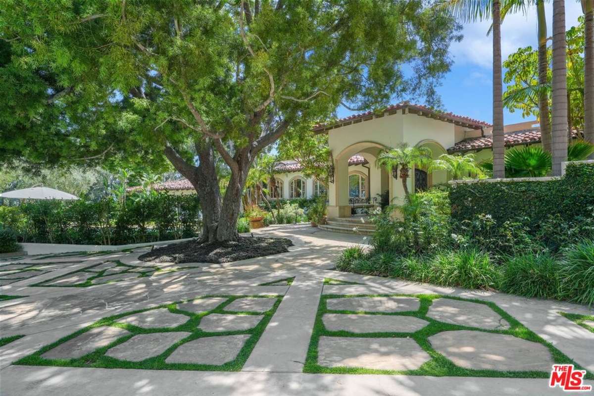 Expansive driveway with geometric stonework.