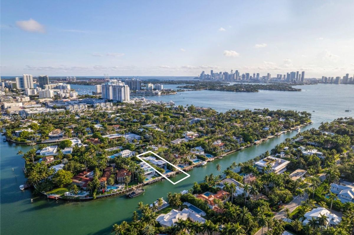 Prime waterfront property nestled in an exclusive Miami neighborhood with breathtaking skyline views.