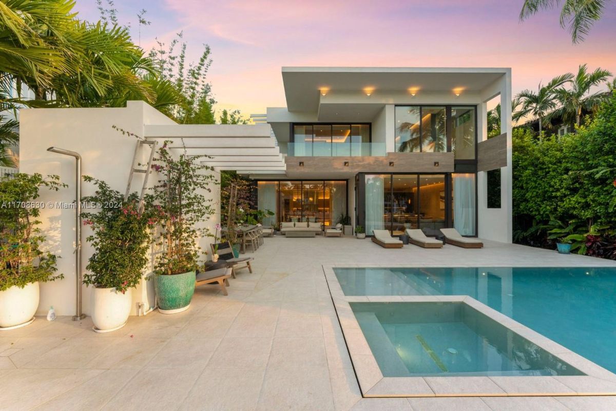 Modern poolside patio featuring a serene ambiance and luxurious outdoor living space.