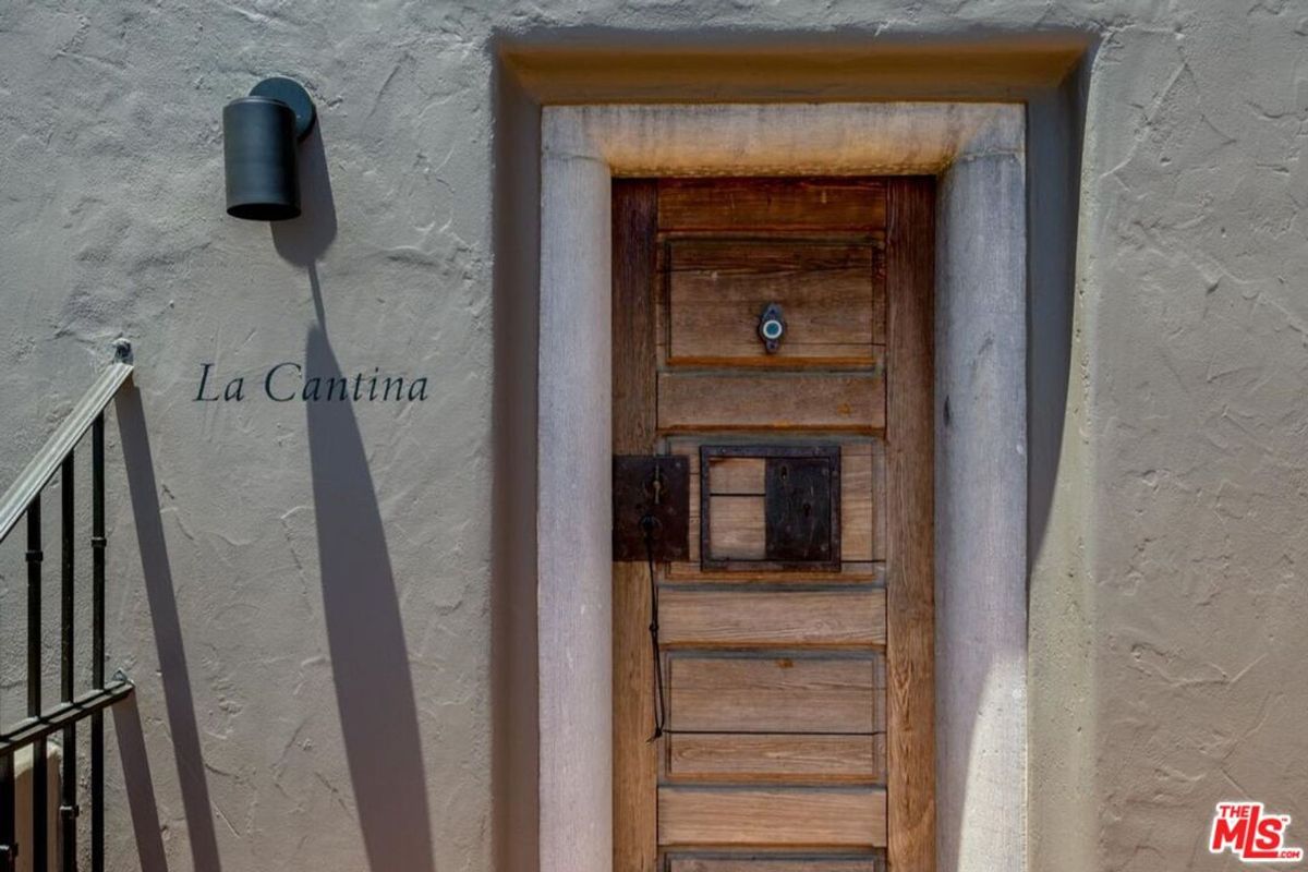 Door labeled "La Cantina" adds character and charm to this inviting space.